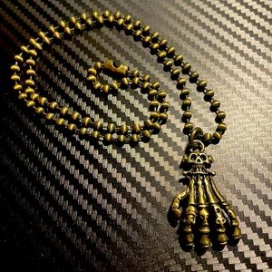 Skeleton hand necklace